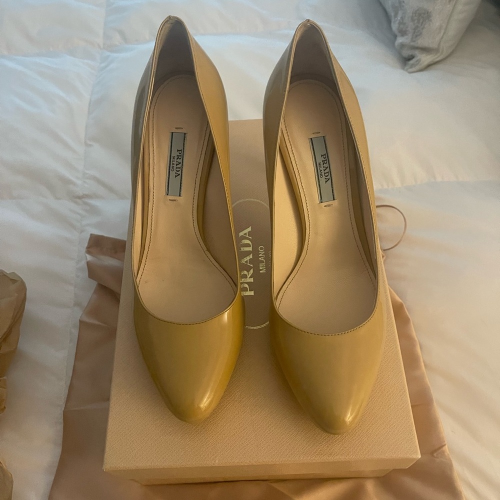Prada 38.5 patent pumps with slight platform. Hardly worn!